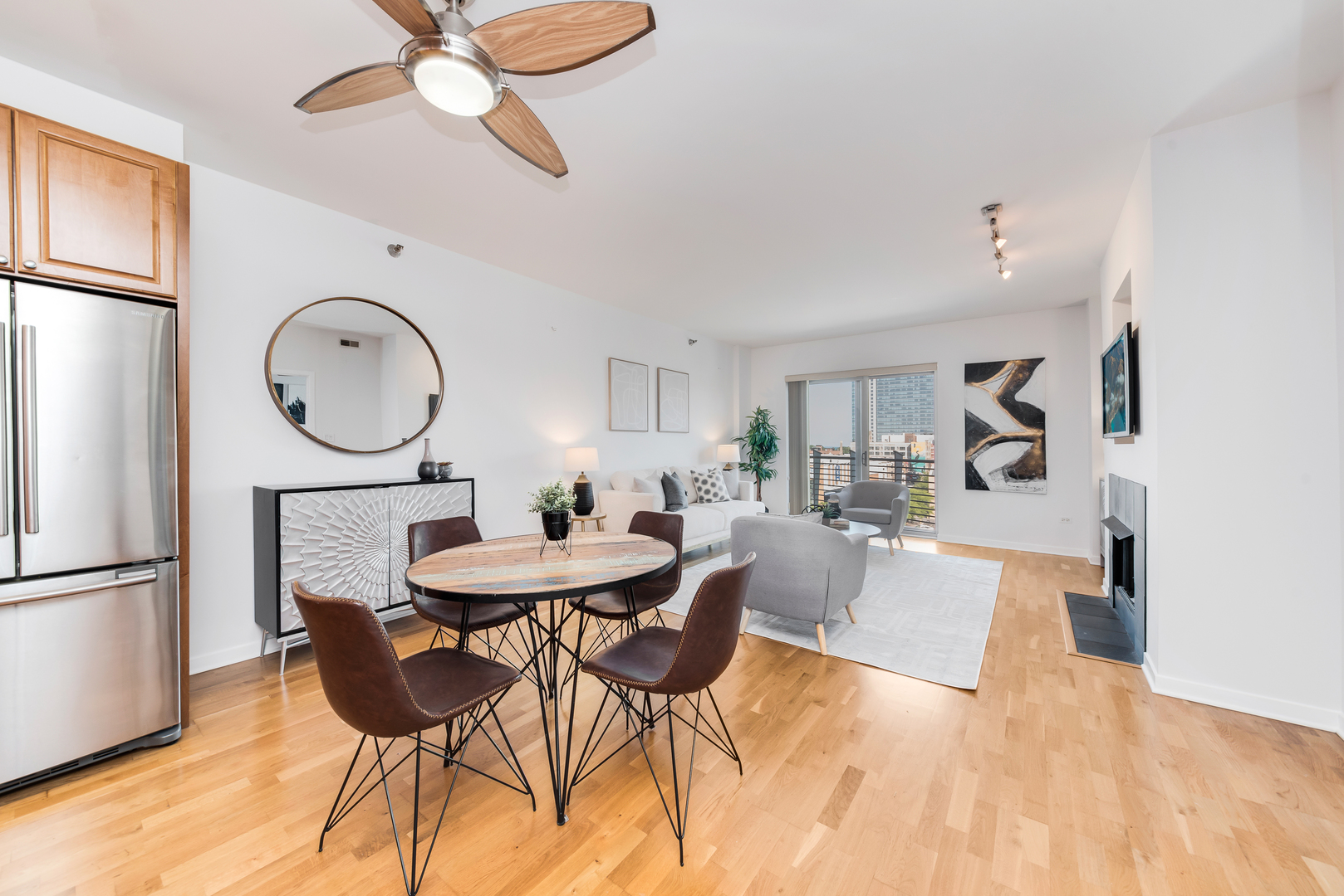4350 North Broadway, Unit 607 Chicago, IL 60613 - Photo 7 of 18 a view of a dining room with furniture and a chandelier