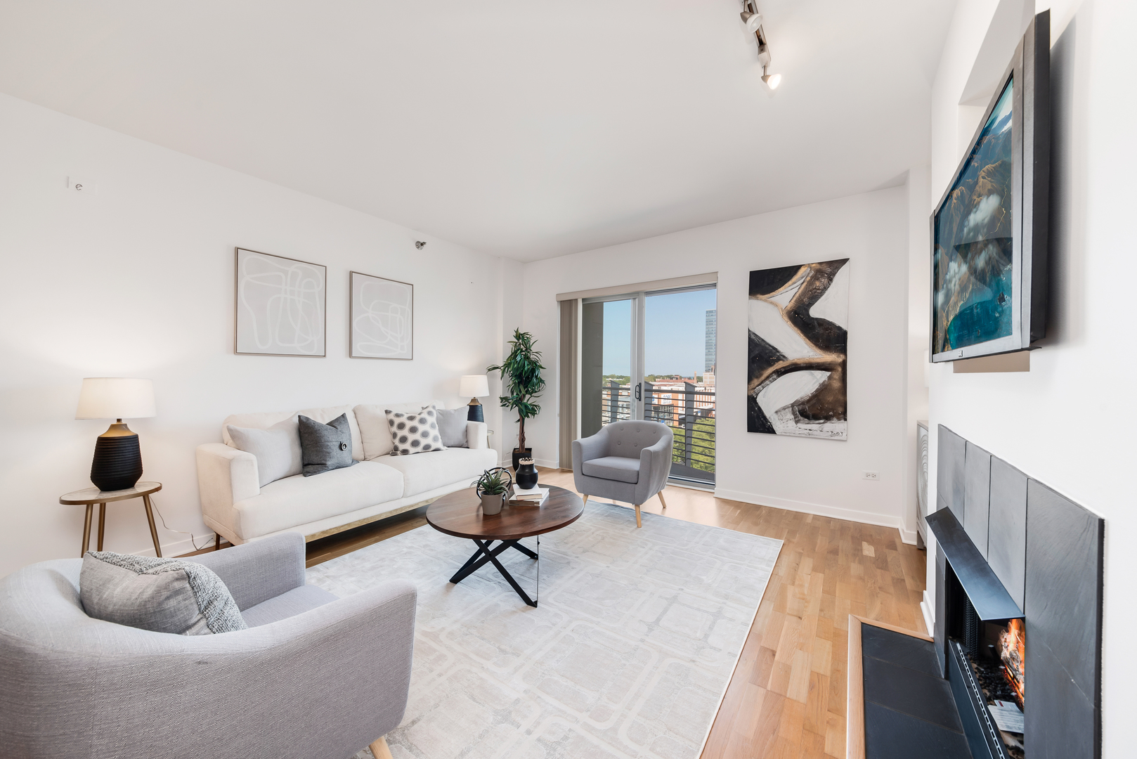 4350 North Broadway, Unit 607 Chicago, IL 60613 - Photo 9 of 18 a living room with furniture and a fireplace