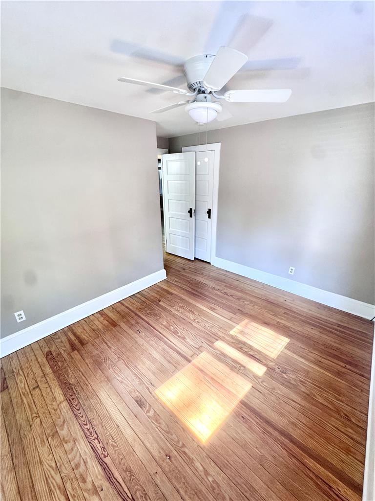 5454 Camp Meeting Road Center Valley, PA 18034 - Photo 19 of 27 Hardwood floors and a ceiling fan create a comfortable atmosphere in this inviting room.