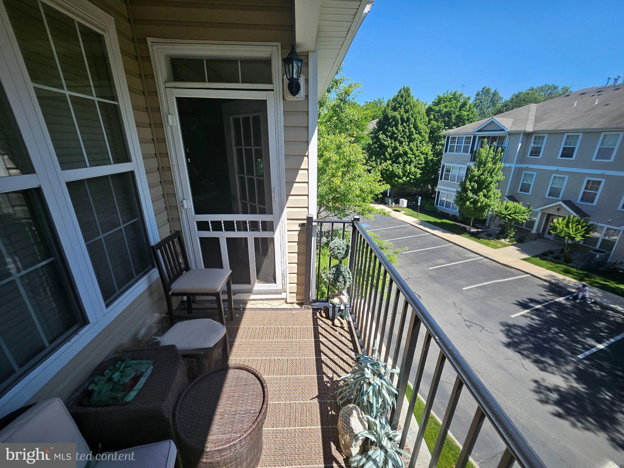 83 Kyle Way Ewing, NJ 08628 - Photo 23 of 36 Sunny balcony with lush greenery.