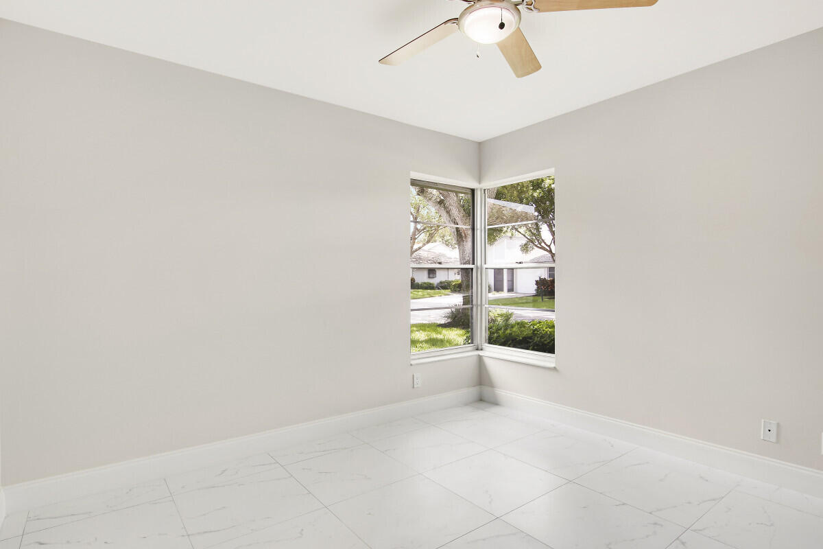 8641 Sunbird Place Boca Raton, FL 33496 - Photo 17 of 24 an empty room with windows