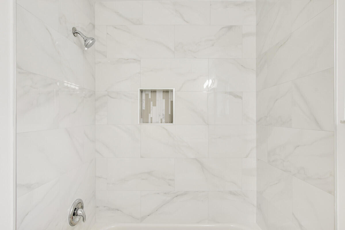 8641 Sunbird Place Boca Raton, FL 33496 - Photo 20 of 24 a bathroom with a shower