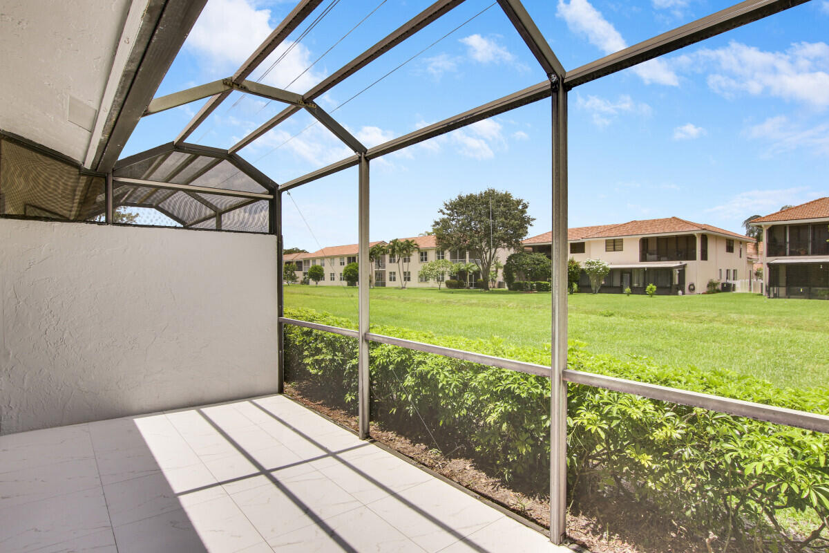 8641 Sunbird Place Boca Raton, FL 33496 - Photo 22 of 24 a view of a balcony with yard