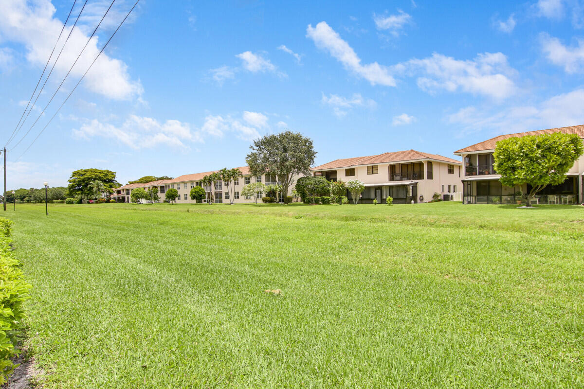 8641 Sunbird Place Boca Raton, FL 33496 - Photo 24 of 24 a view of a house with a big yard
