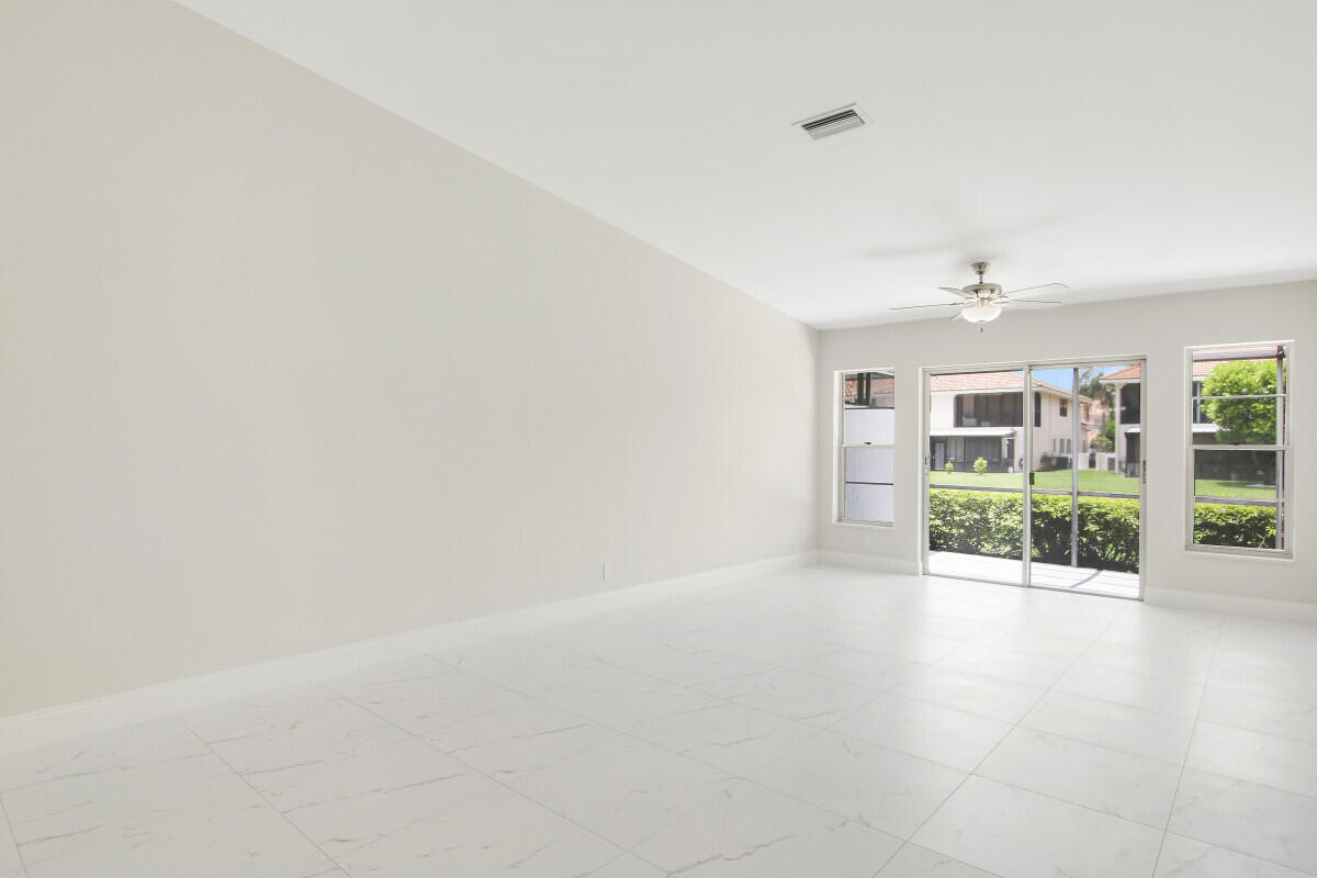 8641 Sunbird Place Boca Raton, FL 33496 - Photo 4 of 24 an empty room with windows