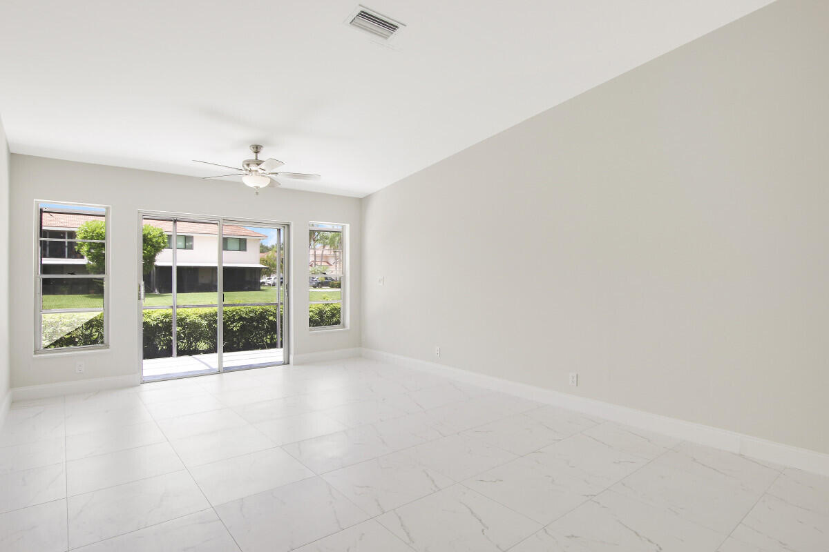 8641 Sunbird Place Boca Raton, FL 33496 - Photo 5 of 24 an empty room with windows