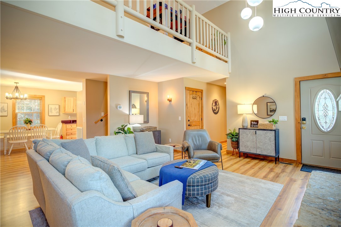 256 Holiday Hills Drive Boone, NC 28607 - Photo 11 of 34 a living room with furniture and a table