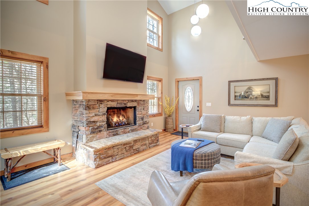 256 Holiday Hills Drive Boone, NC 28607 - Photo 12 of 34 a living room with furniture fireplace and flat screen tv