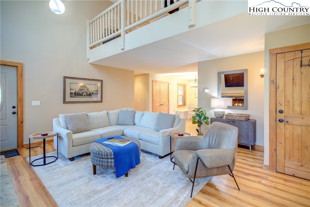 256 Holiday Hills Drive Boone, NC 28607 - Photo 13 of 34 a living room with furniture and a wooden floor