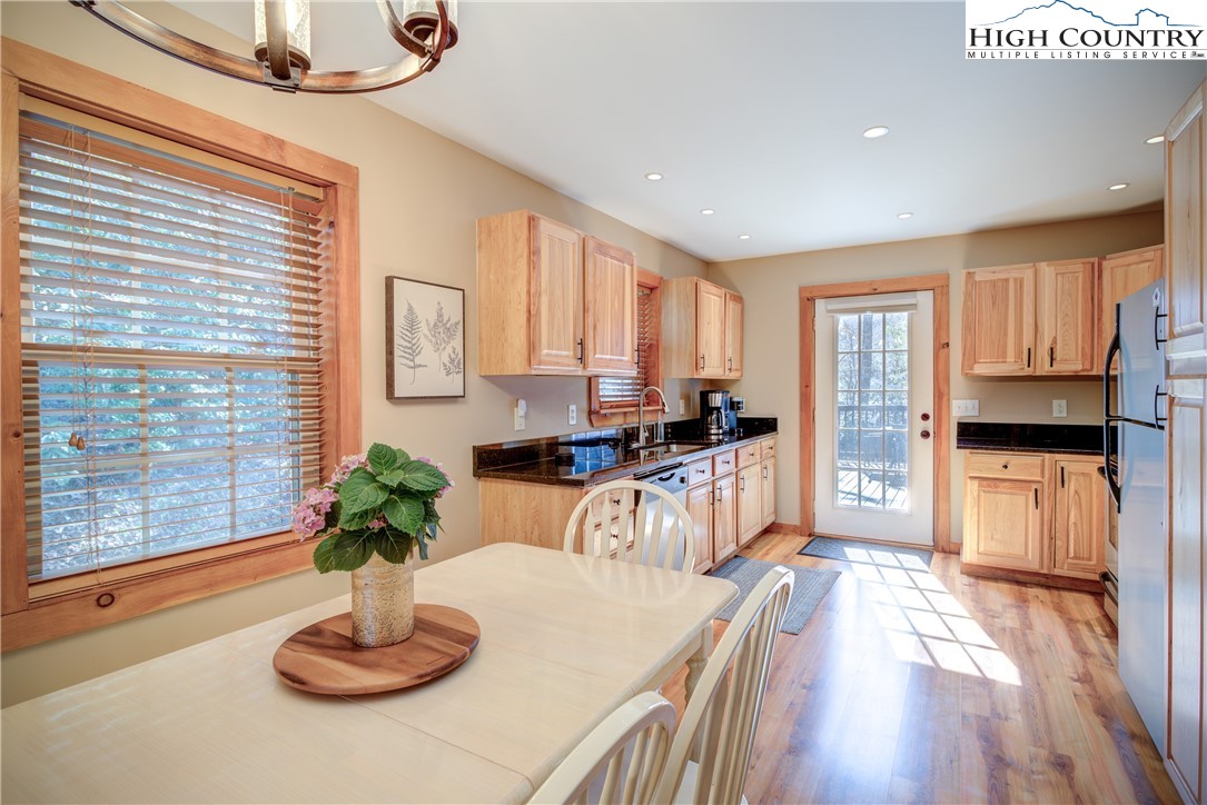 256 Holiday Hills Drive Boone, NC 28607 - Photo 15 of 34 a kitchen with a table and chairs