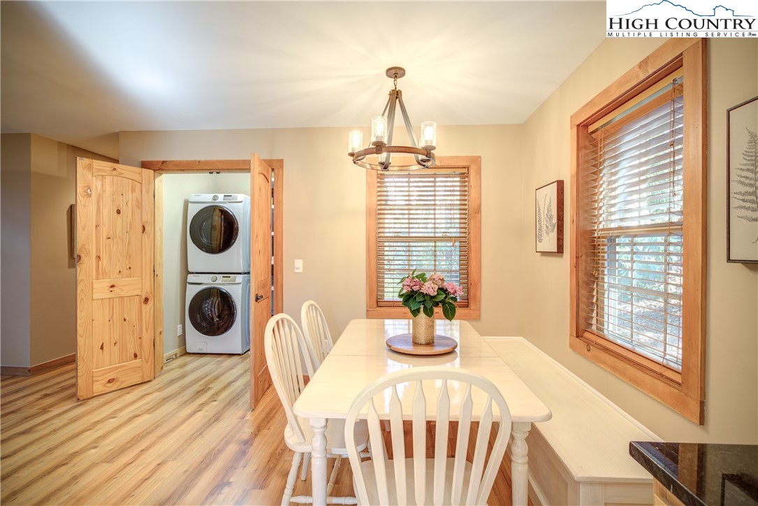 256 Holiday Hills Drive Boone, NC 28607 - Photo 19 of 34 a view of a dining room with furniture window and outside view