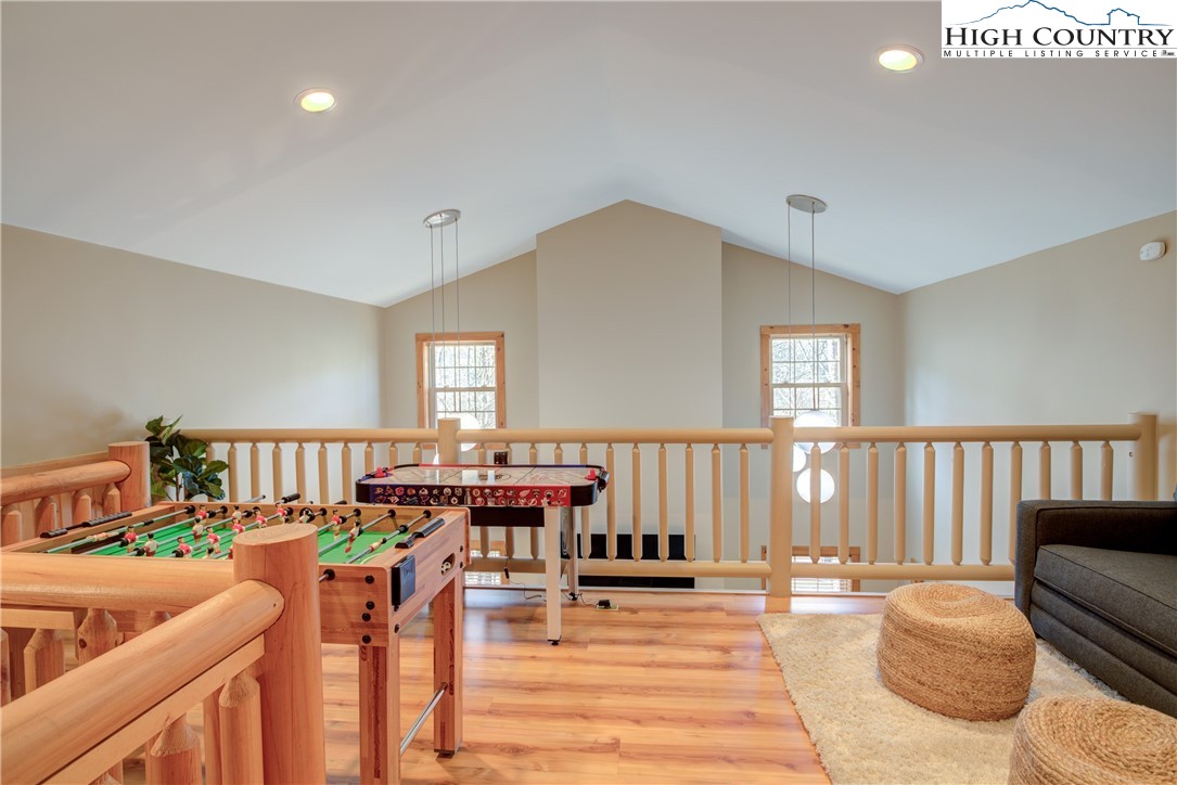 256 Holiday Hills Drive Boone, NC 28607 - Photo 28 of 34 a living room with furniture a piano and a window
