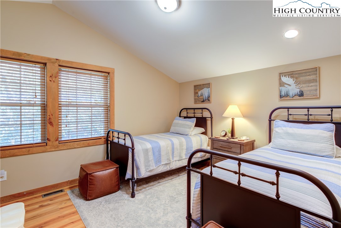 256 Holiday Hills Drive Boone, NC 28607 - Photo 29 of 34 a bedroom with furniture and a window