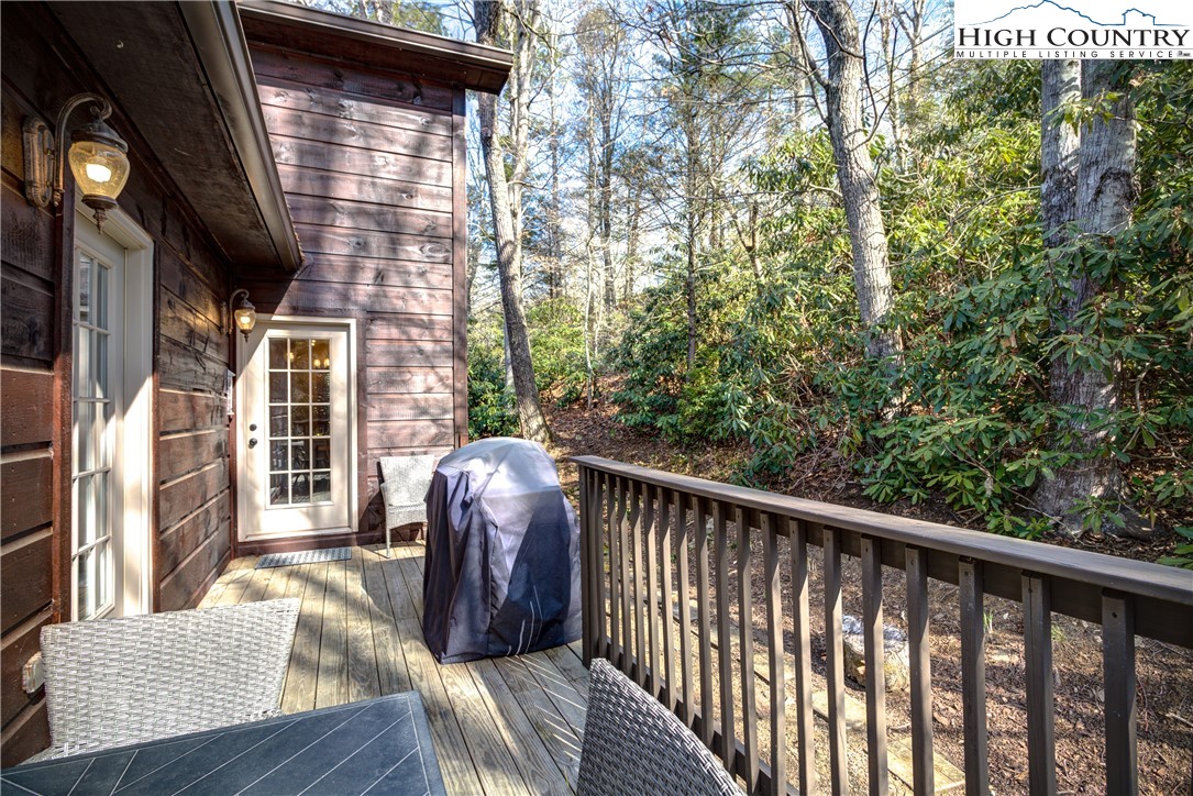 256 Holiday Hills Drive Boone, NC 28607 - Photo 6 of 34 a view of balcony with furniture and wooden floor