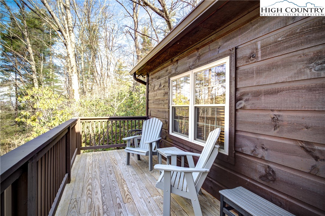 256 Holiday Hills Drive Boone, NC 28607 - Photo 7 of 34 a view of balcony with wooden floor and outdoor seating