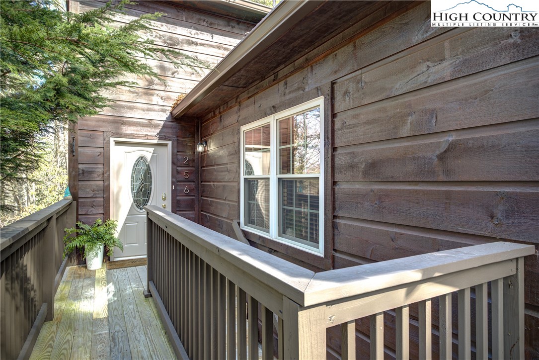 256 Holiday Hills Drive Boone, NC 28607 - Photo 10 of 34 a view of a balcony with chairs
