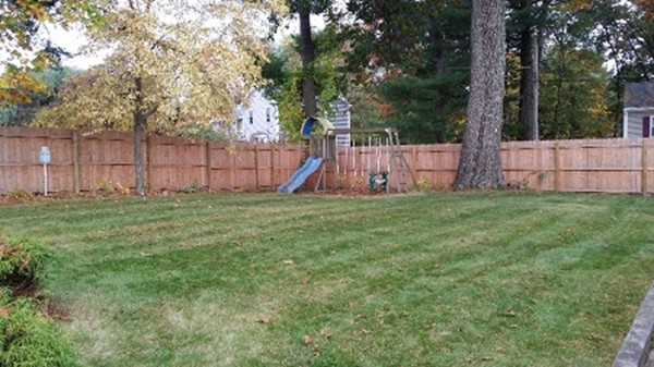 3 Eclipse Avenue Chelmsford, MA 01824 - Photo 2 of 6 a view of a backyard with a barn and large trees