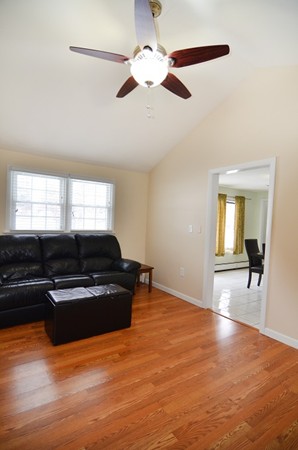 3 Eclipse Avenue Chelmsford, MA 01824 - Photo 6 of 6 a living room with furniture and a large window