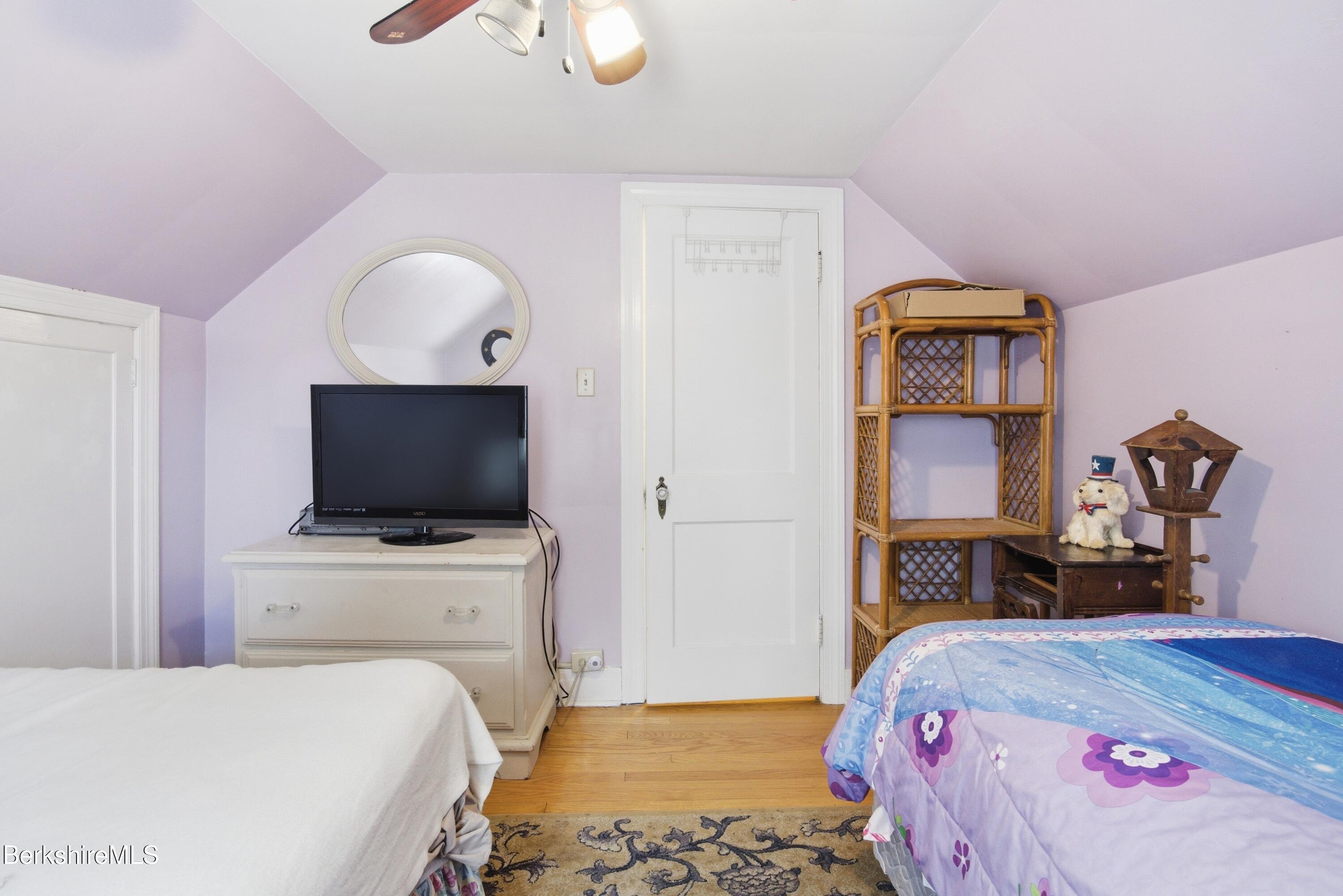 53 Edison Avenue Pittsfield, MA 01201 - Photo 21 of 45 a bedroom with a bed and a flat screen tv