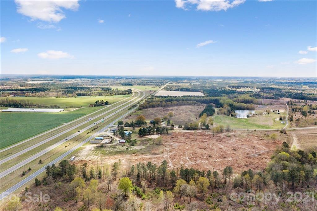 129 Yarborough Road Candor, NC 27229 - Photo 11 of 19 a view of a lake with a city