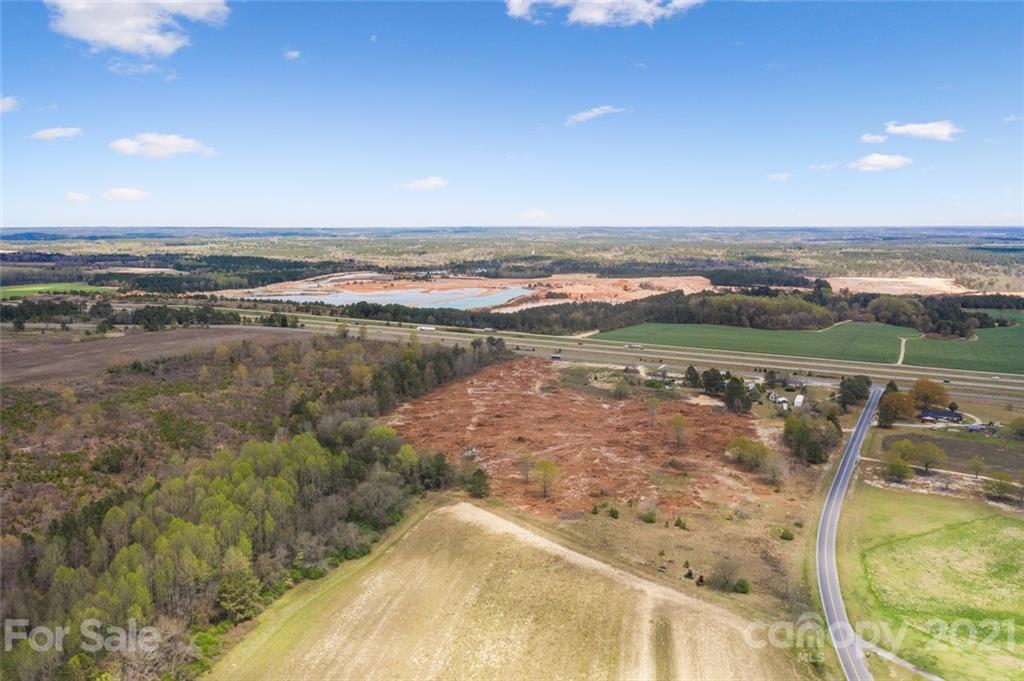129 Yarborough Road Candor, NC 27229 - Photo 5 of 19 a view of a lake with a mountain