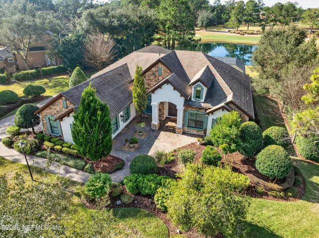 an aerial view of a house with a garden and plants