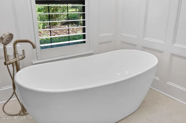 an aerial view of a house with a lake view