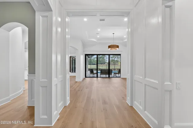 a view of a kitchen with cabinet and a chandelier