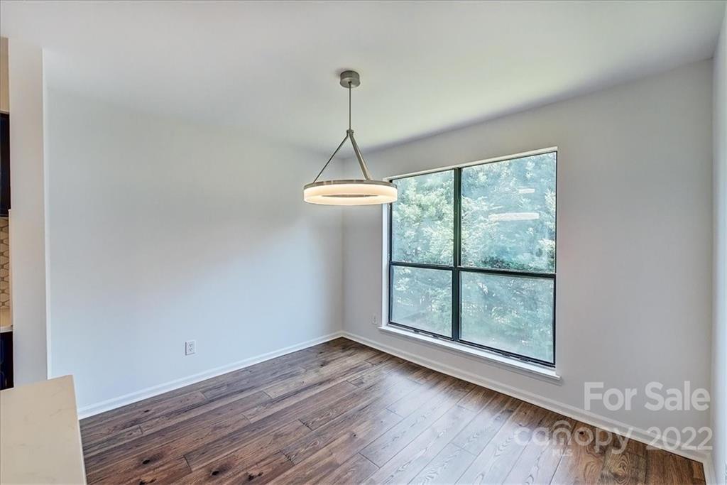 11019 Running Ridge Rd. Charlotte, NC 28226 - Photo 11 of 31 a room with a wooden floor and a window