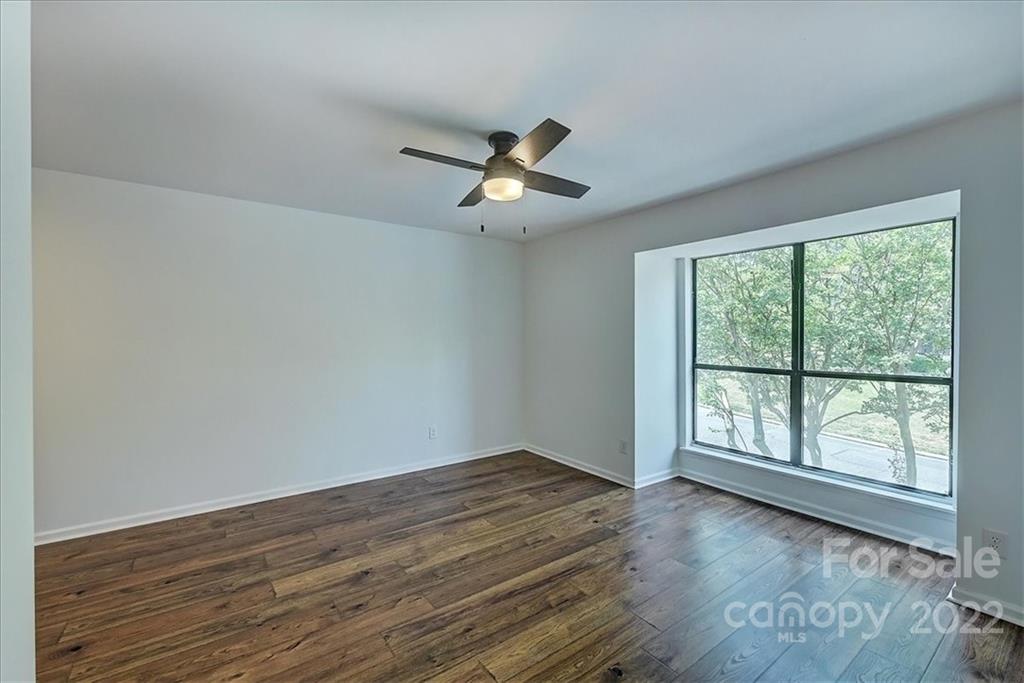 11019 Running Ridge Rd. Charlotte, NC 28226 - Photo 17 of 31 wooden floor in an empty room with a window