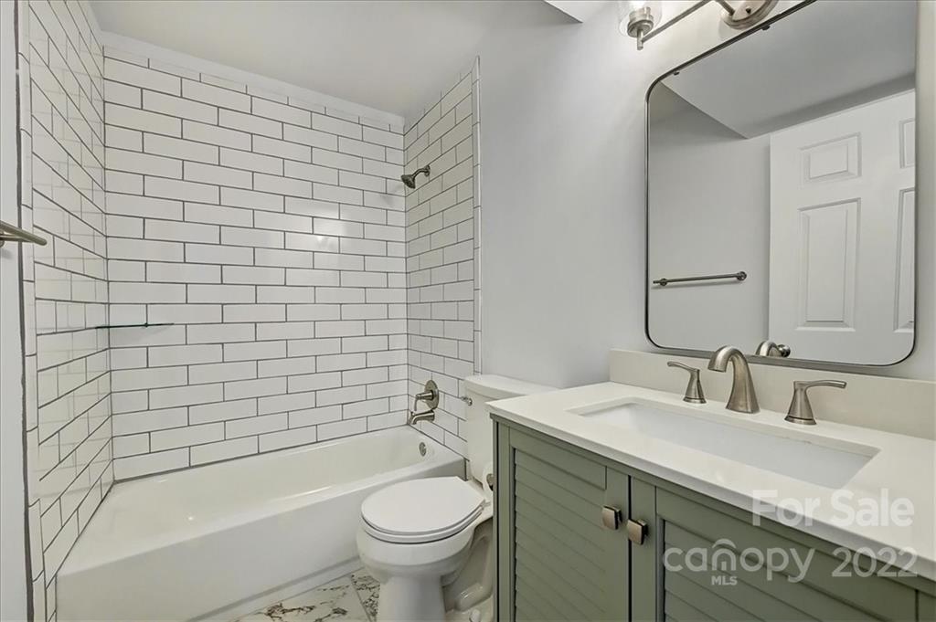 11019 Running Ridge Rd. Charlotte, NC 28226 - Photo 21 of 31 a bathroom with a sink a toilet and shower