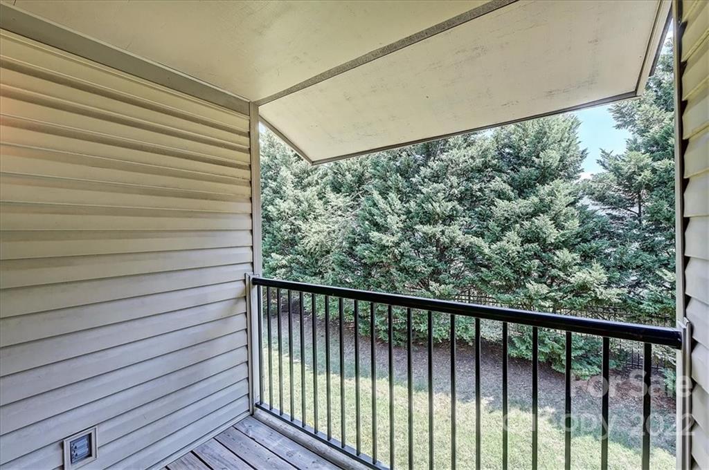 11019 Running Ridge Rd. Charlotte, NC 28226 - Photo 24 of 31 a view of a balcony with wooden fence