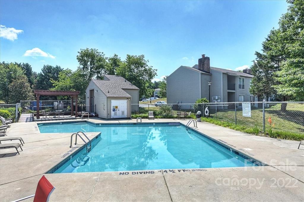 11019 Running Ridge Rd. Charlotte, NC 28226 - Photo 29 of 31 swimming pool view with a seating space and a garden view