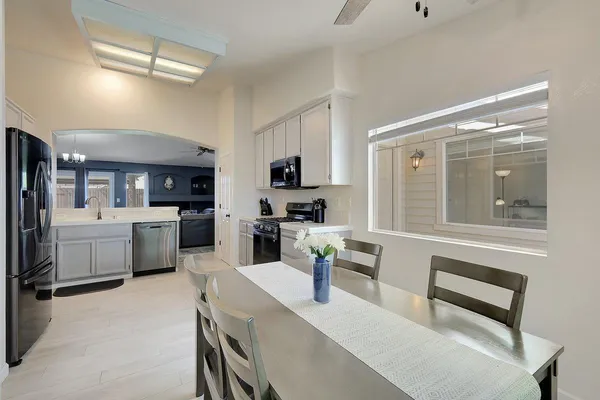 a kitchen with a sink stainless steel appliances and cabinets