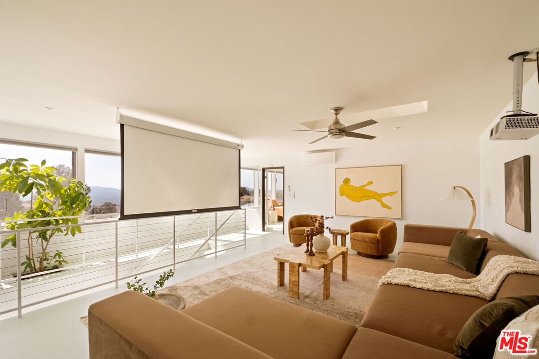 7401 Studio Road Canoga Park, CA 91304 - Photo 14 of 30 a living room with furniture and a flat screen tv