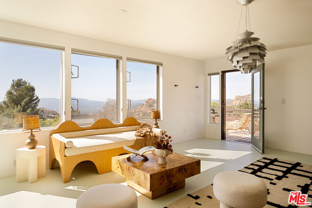 7401 Studio Road Canoga Park, CA 91304 - Photo 17 of 30 a theatre with furniture and floor to ceiling window