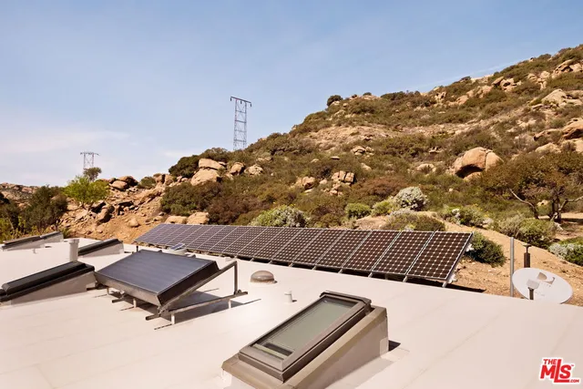 a view of roof with sitting area