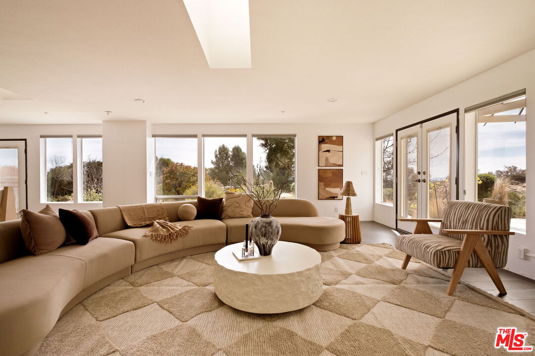 7401 Studio Road Canoga Park, CA 91304 - Photo 3 of 30 a living room with furniture and a large window with outer view