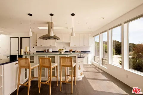 a view of living room with furniture and floor to ceiling window