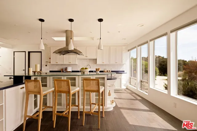a view of living room with furniture and floor to ceiling window