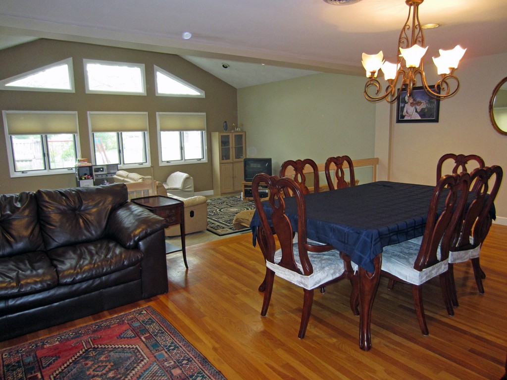 15 Yale Road Needham, MA 02494 - Photo 3 of 5 a view of a dining room with furniture and chandelier