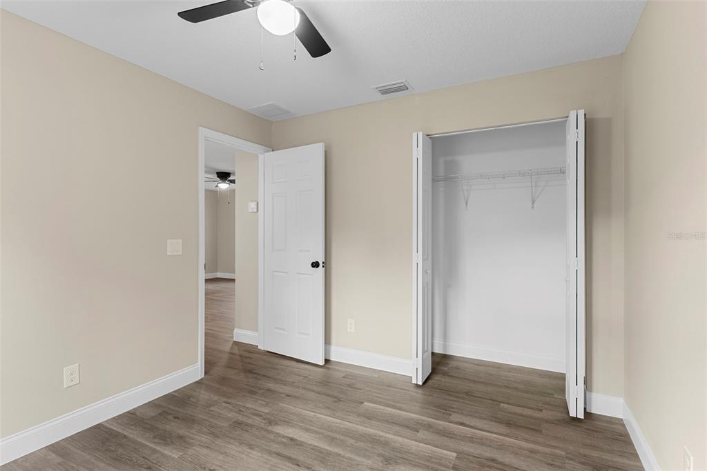 603 Moose Lodge Road, Unit A Bartow, FL 33830 - Photo 17 of 22 a view of an empty room with wooden floor