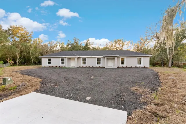 a front view of a house with yard