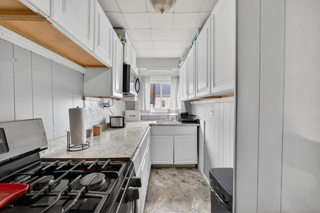 a kitchen with a stove and a refrigerator