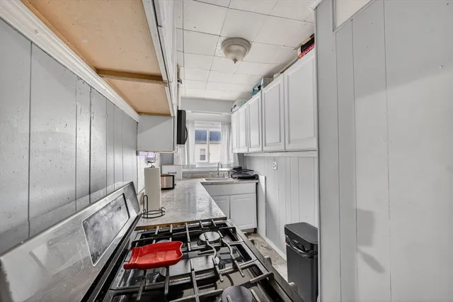 a kitchen with a stove and a refrigerator
