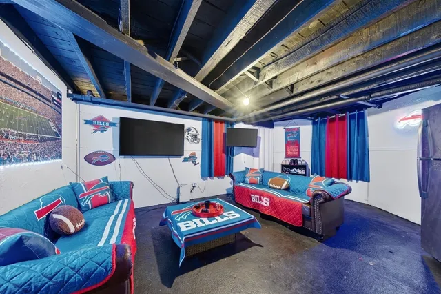 a living room with furniture and a flat screen tv