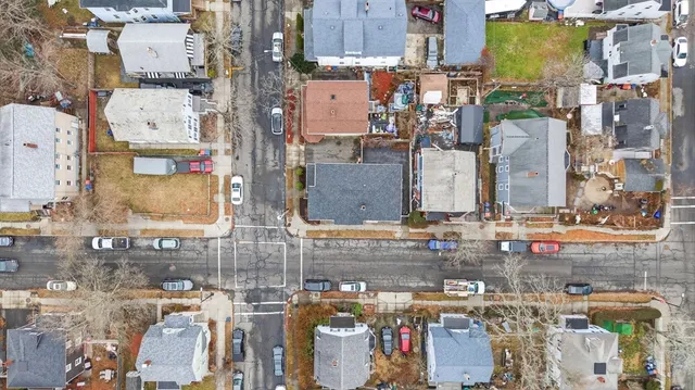 an aerial view of residential houses with outdoor space