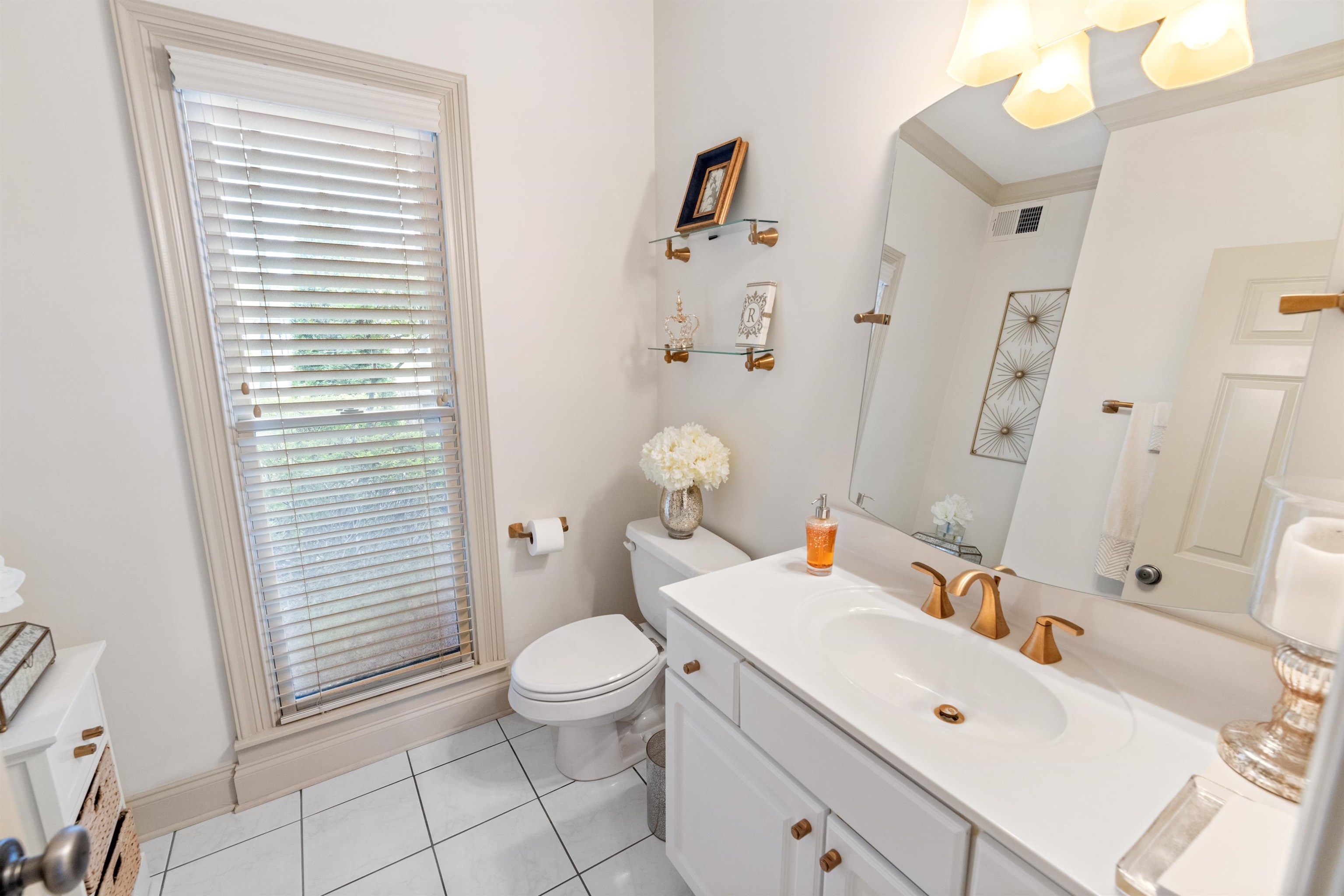11241 Latting Road Eads, TN 38028 - Photo 17 of 31 Bathroom with tile patterned floors, vanity, ornamental molding, toilet, and an enclosed shower