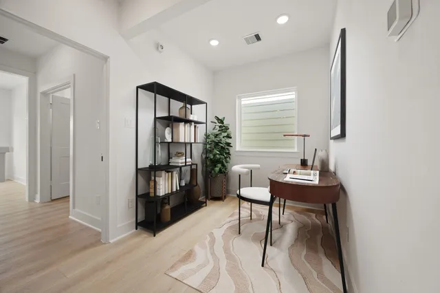 a spacious bedroom with a large bed and a couch