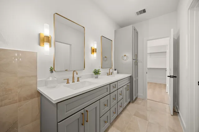 a bathroom with a bathtub and a sink